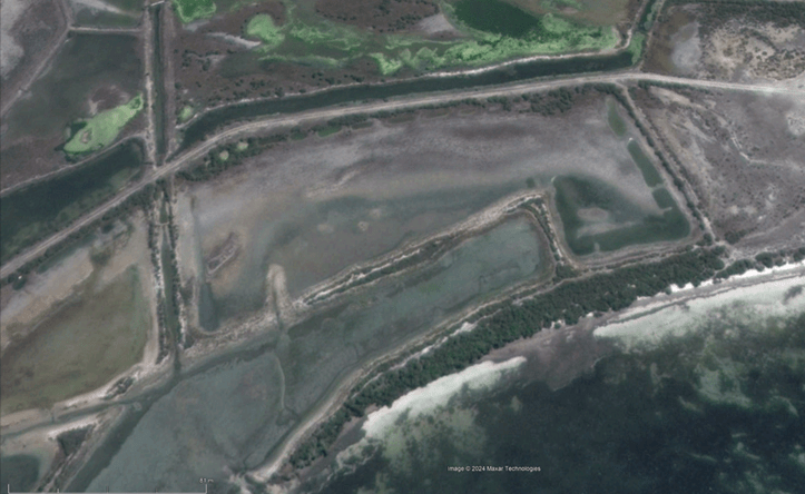 An older aerial photo of the saltworks shows some basic features of the landscape, devoid of vegetation