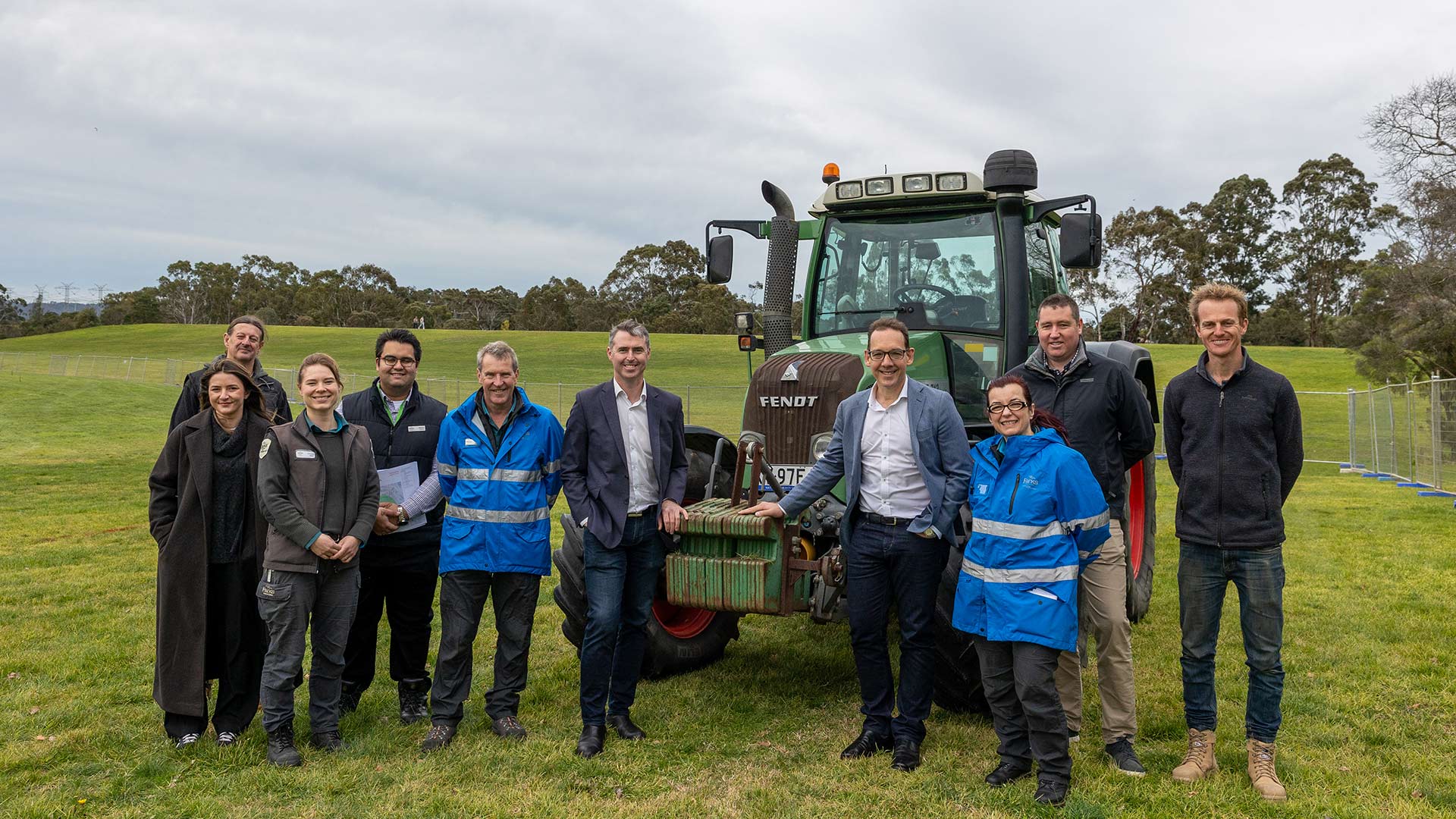 Minister Dimopoulos and Member for Glen Waverley John Mullahy post with the local Parks Victoria team