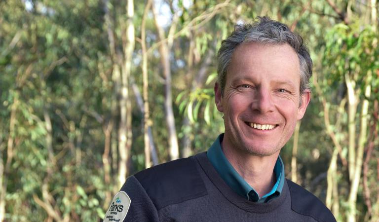 Parks Victoria Ranger smiles at the camera