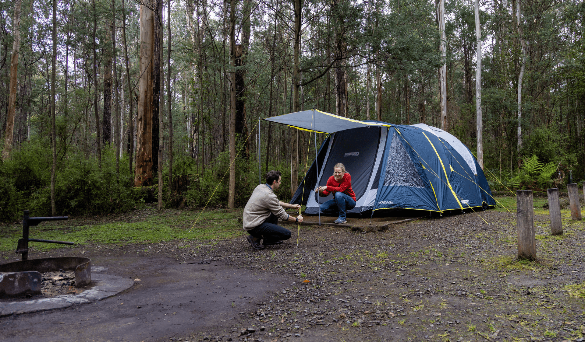 Couple setting up their tent at The Gums Campground in Kinglake National Park