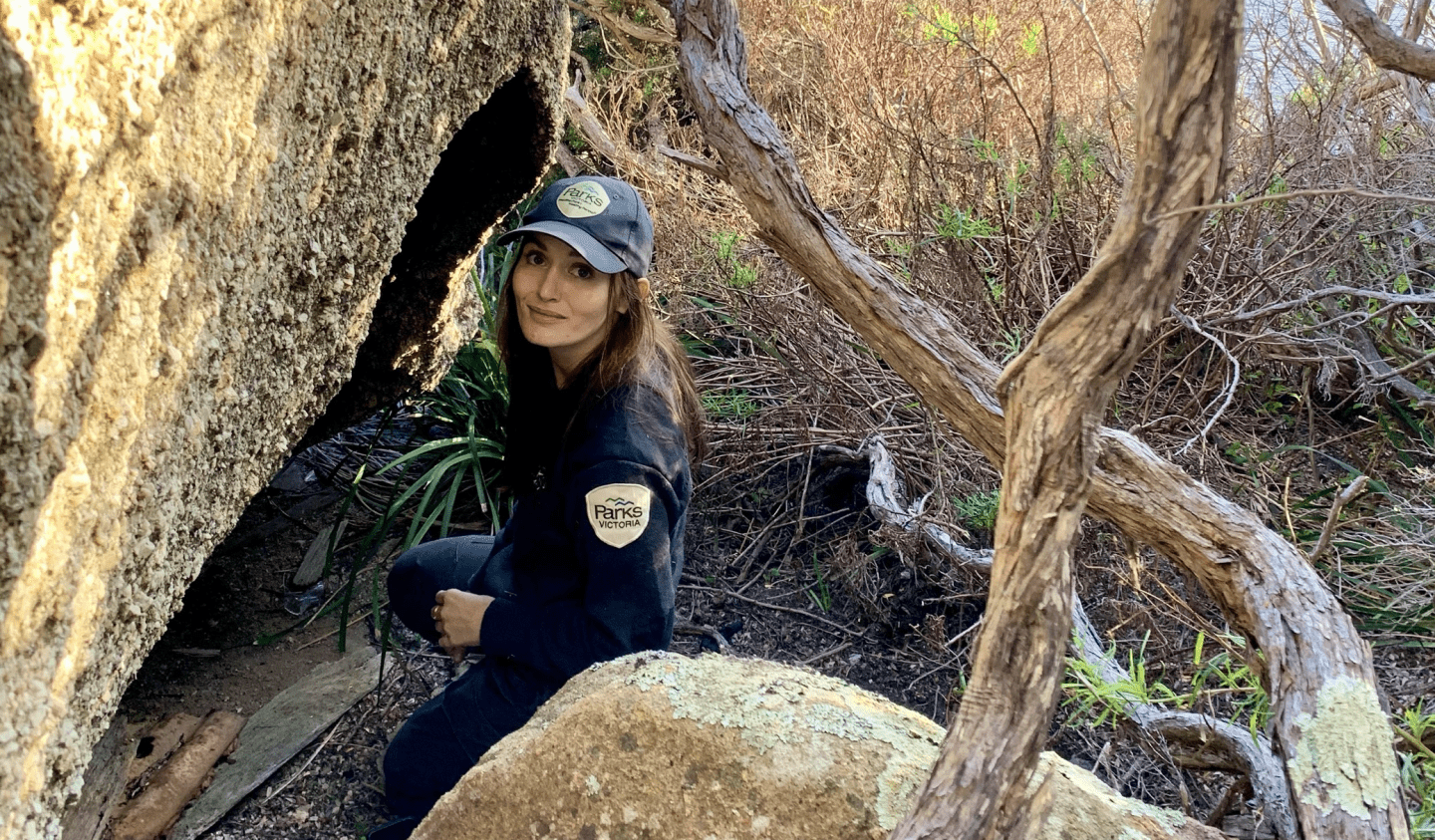 A ranger smiles at the camera