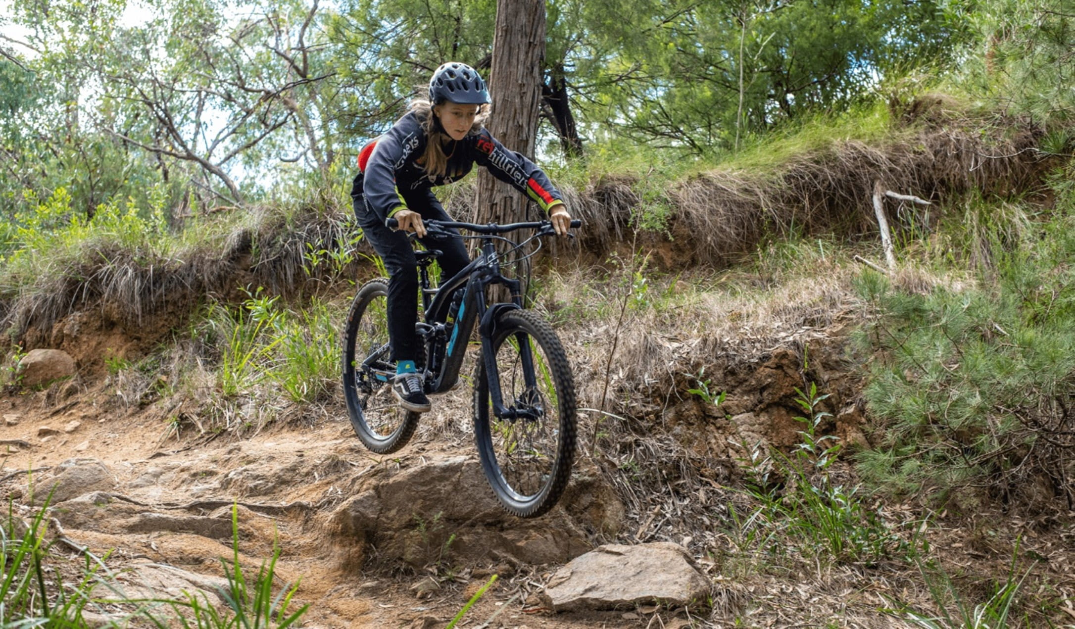 a person bike riding down a path
