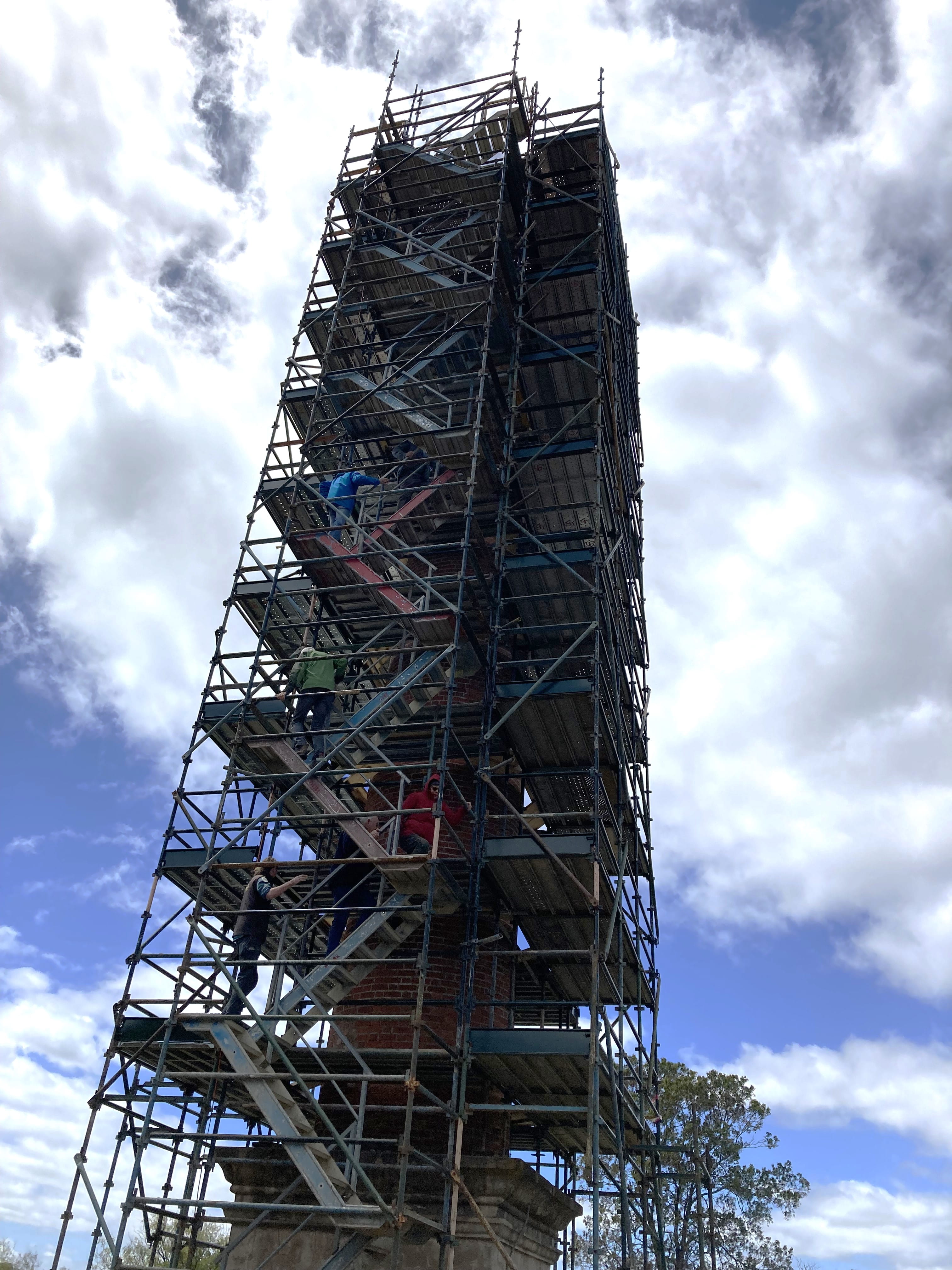 A tall chimney surrounded by scaffholding