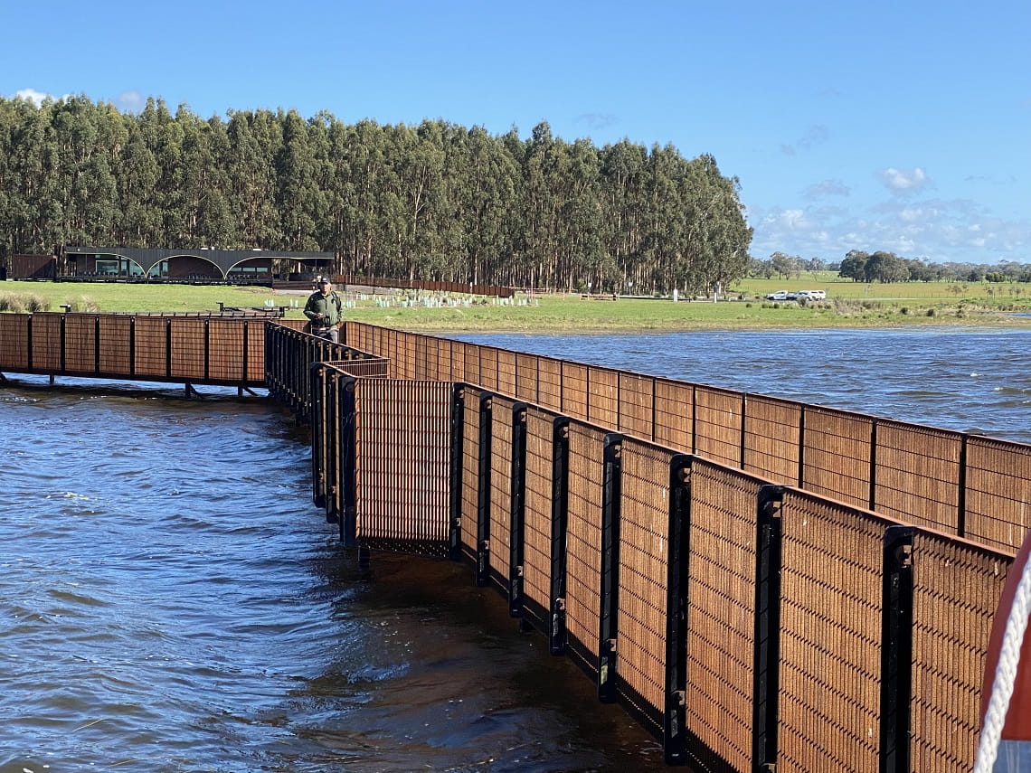  Superintendent Jorge Silva Bañuelos at Tae Rak (Lake Condah) on Gunditjmara Country, and the newly completed Tae Rak Aquaculture Centre in the background. Credit Parks Victoria.