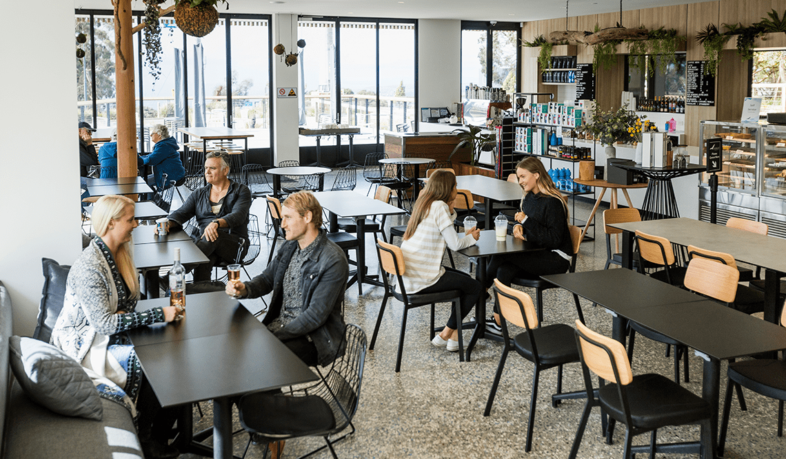 Patrons drink coffee and wine at the Eagle Cafe in Arthurs Seat State Park