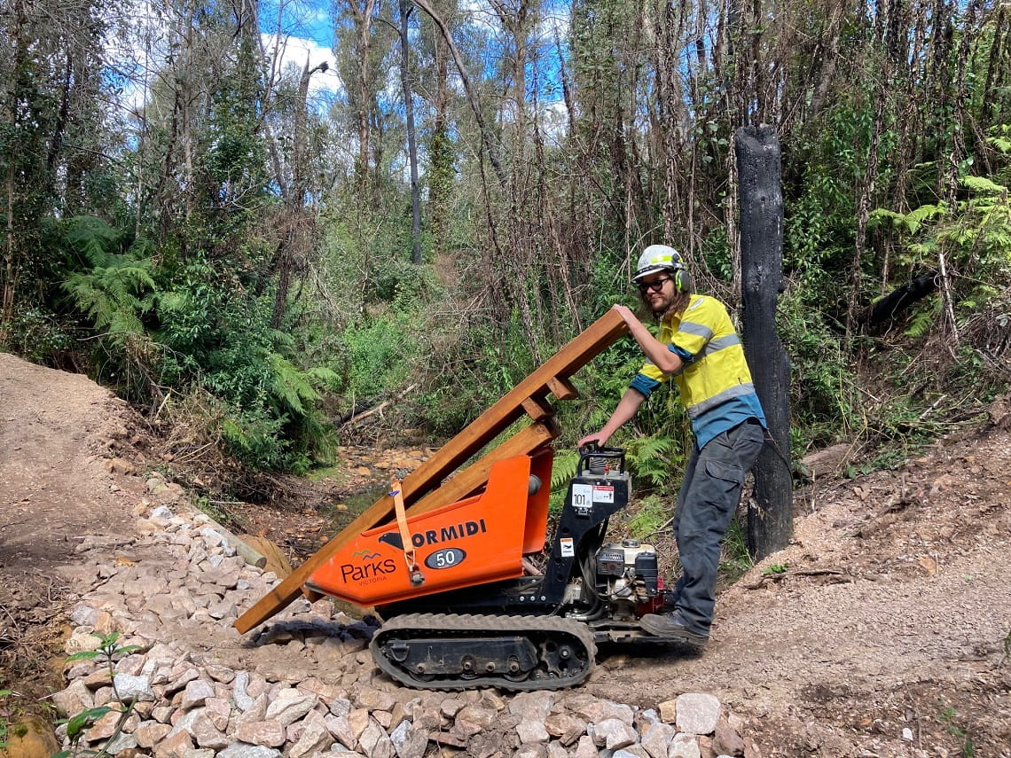 Parks Victoria team member repairing a trail