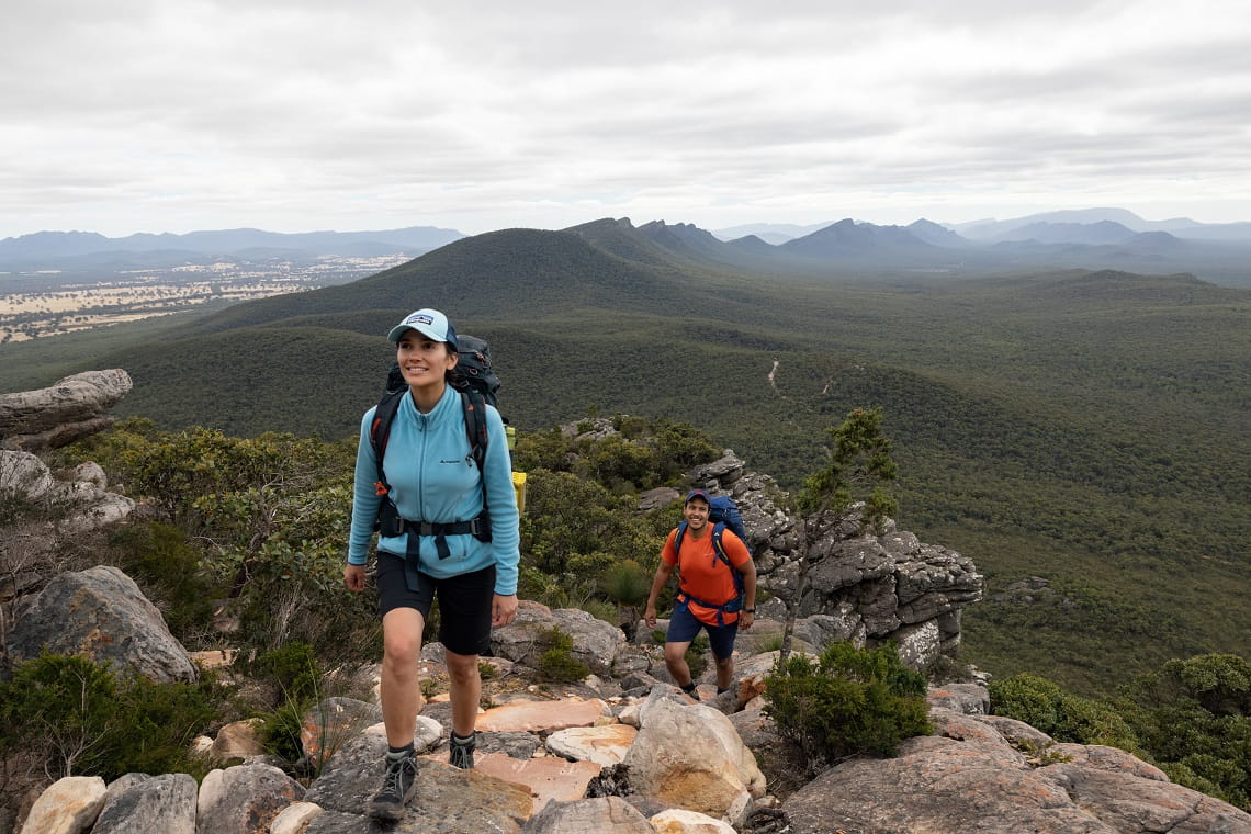 Two people hike the Grampians (Gariwerd) Peaks Trail