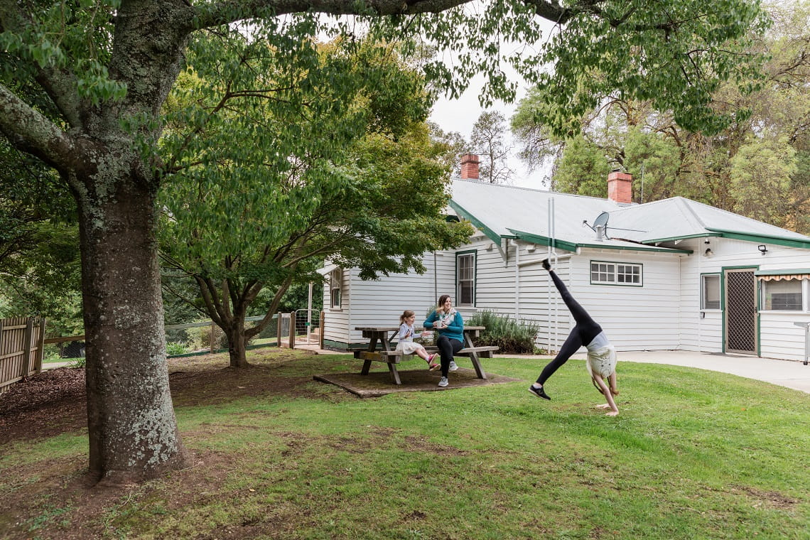Family spending the afternoon in the backyard of Buchan Caves House. 
