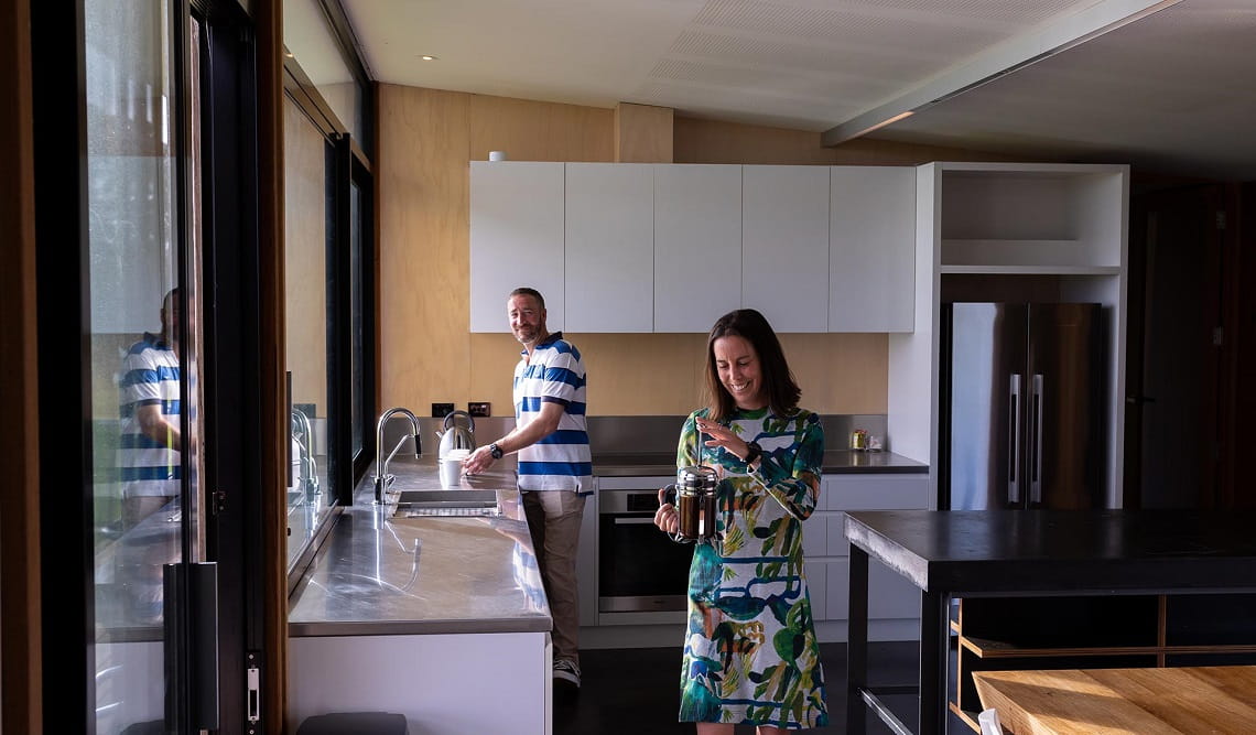 Visitors spending time in the pristine kitchen in Just Inside the Gate 