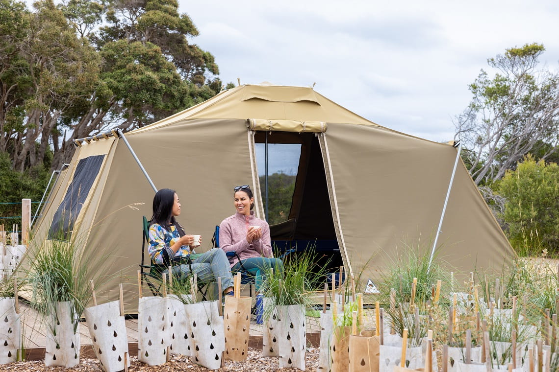 Two friends relaxing at Point Nepean Discovery Tents