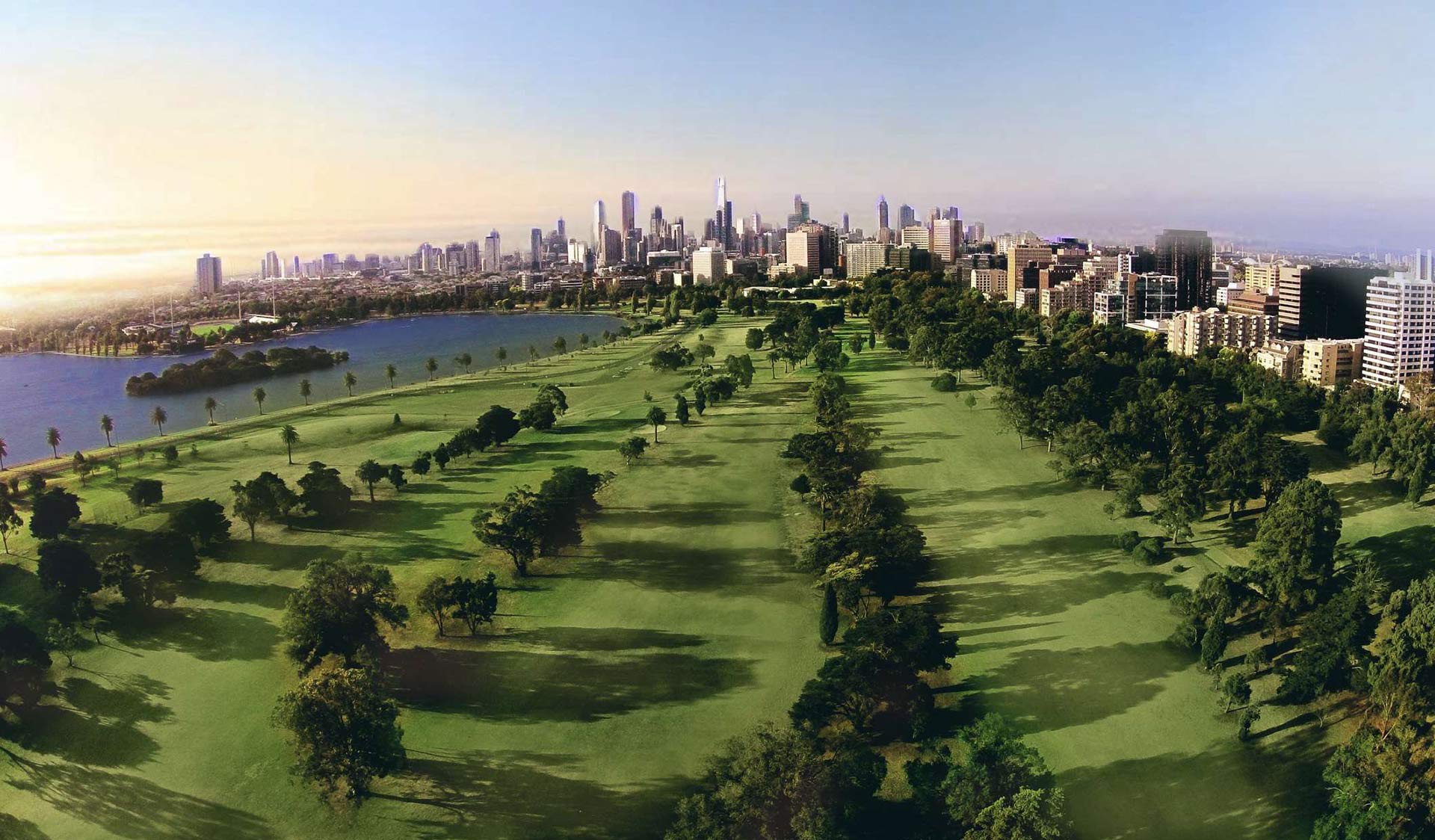 Albert Park Golf Course with views of Melbourne's CBD skyline in the background.