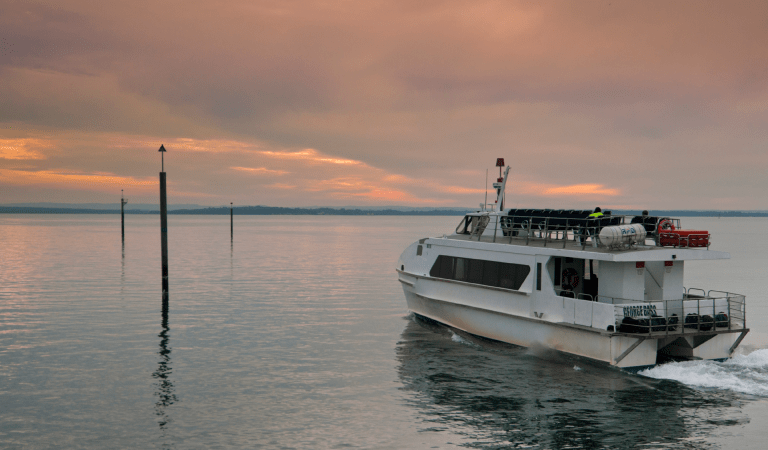 A boat on the water at sunset French Island National Park