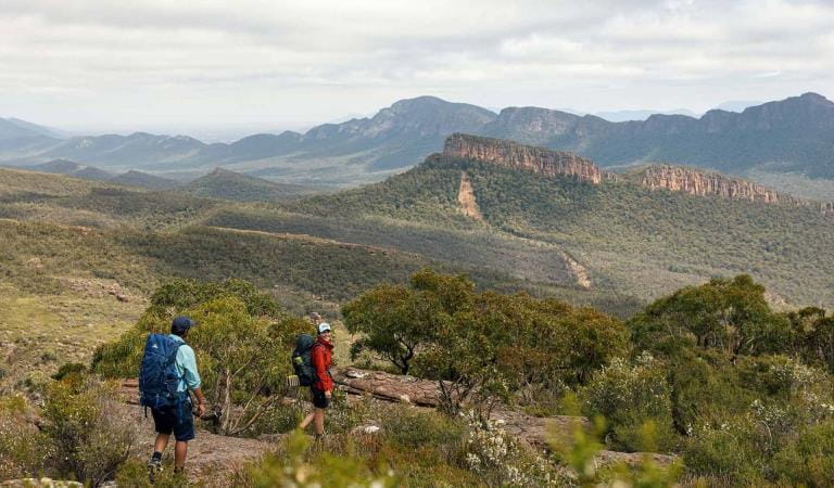 Two friends walk along the track south of Redmans Bluff with views of the Serra Range in the background on central section 3 of the GPT