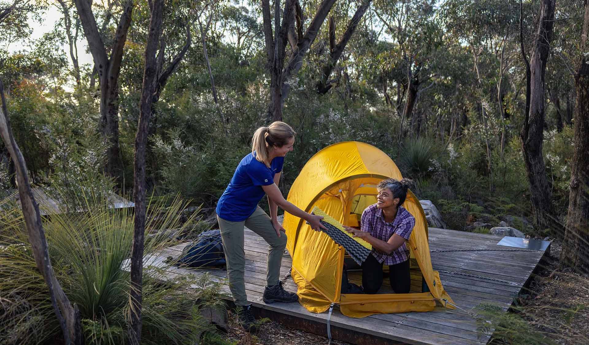 Two friends set up their tent at Duwul hiker camp at the end of central section 4 