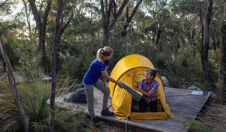 Two friends set up their tent at Duwul hiker camp at the end of central section 4