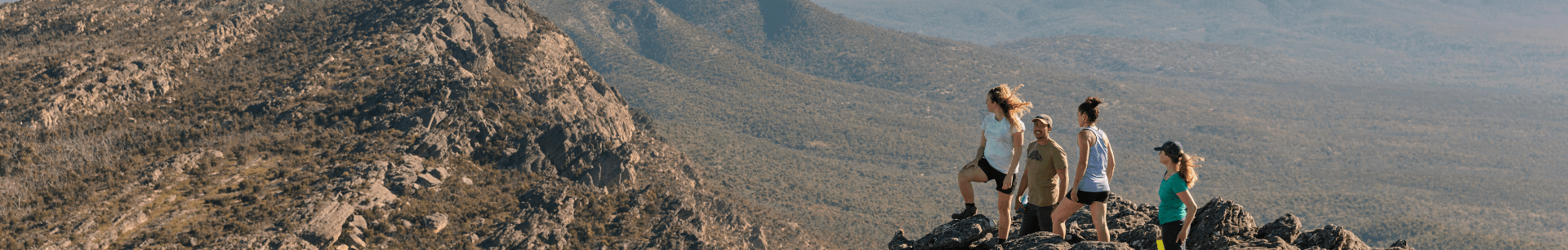 group of hikers standing on a mountain