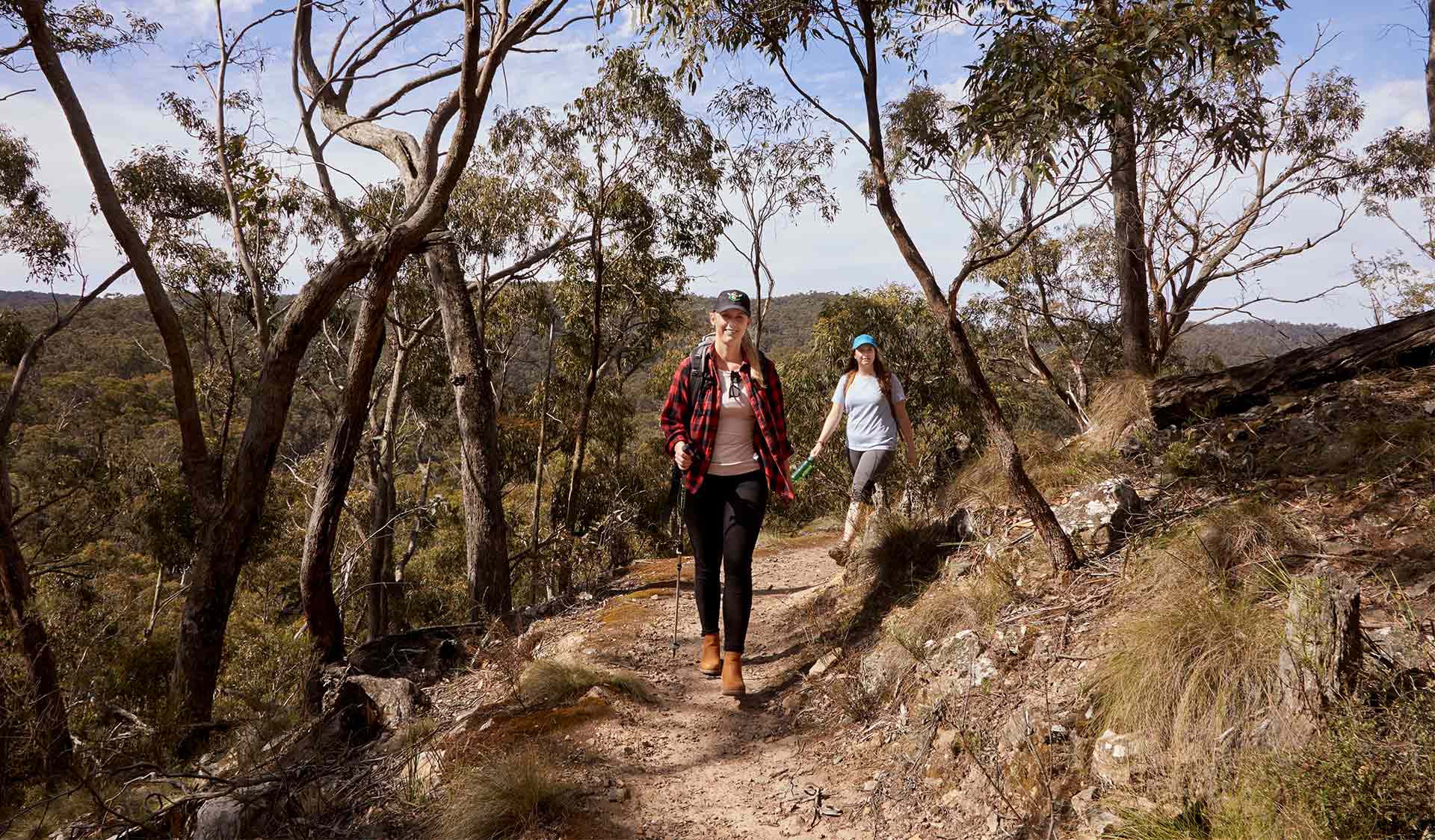 A woman leading a friend on a walk along Byers BackTrack