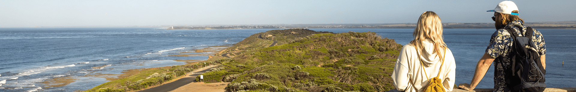 Two people looking out from lookout.