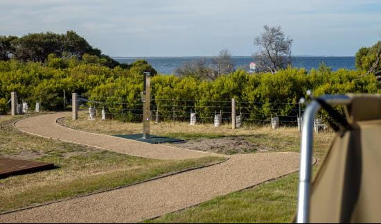 Outdoor shower in a coastal landscape.