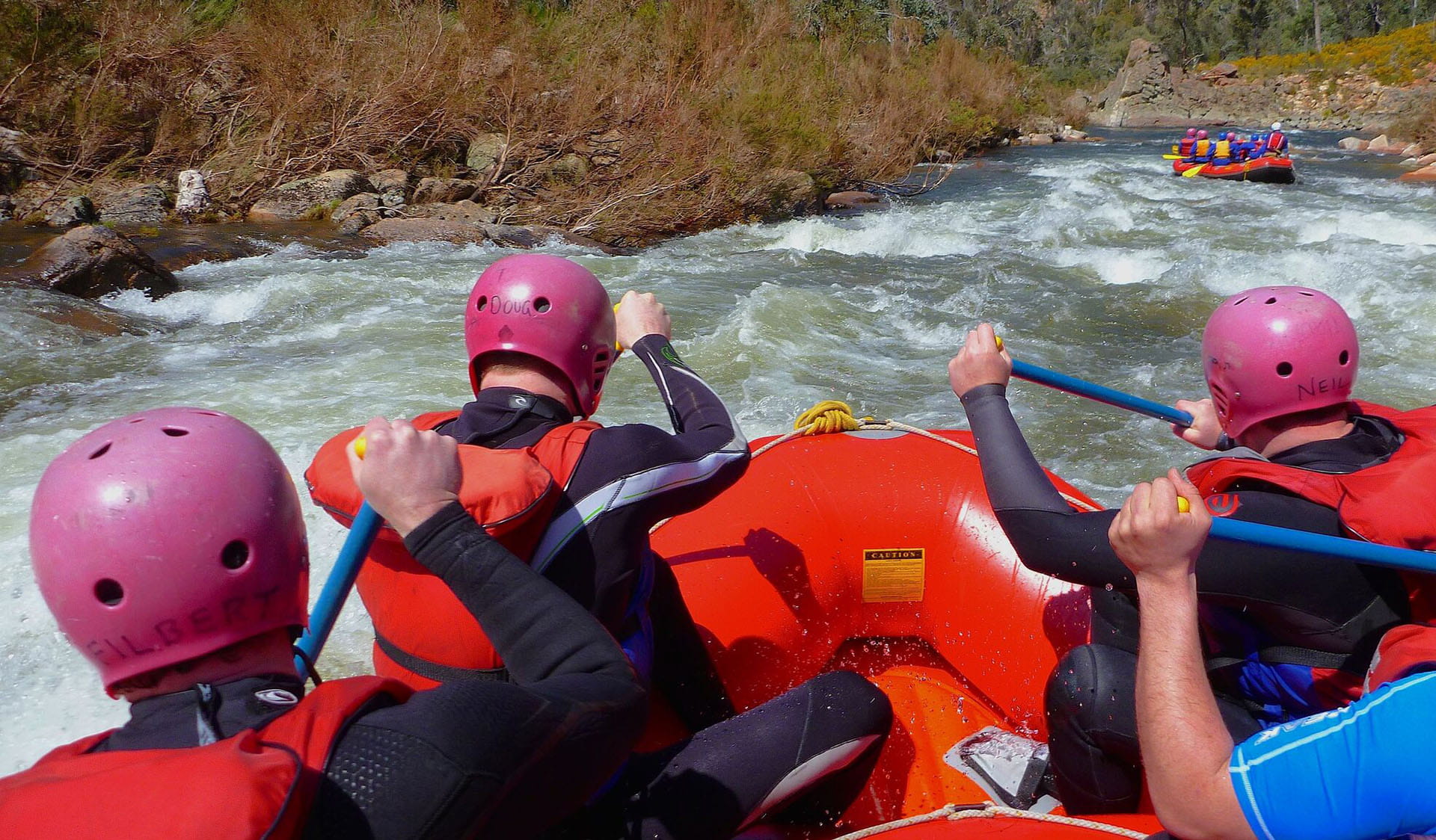 Back view of rafting group in the Mitta River Gorge, Alpine National Park