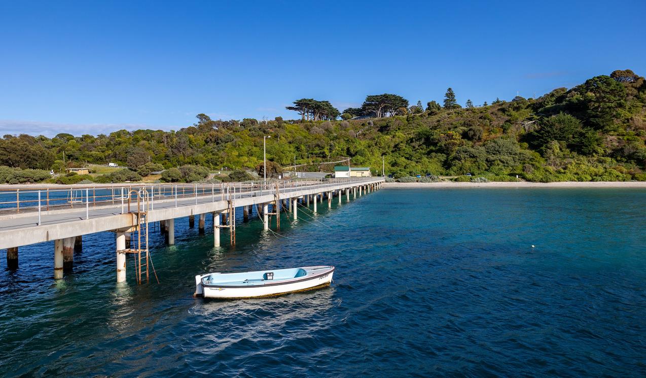small boat moored at a pier